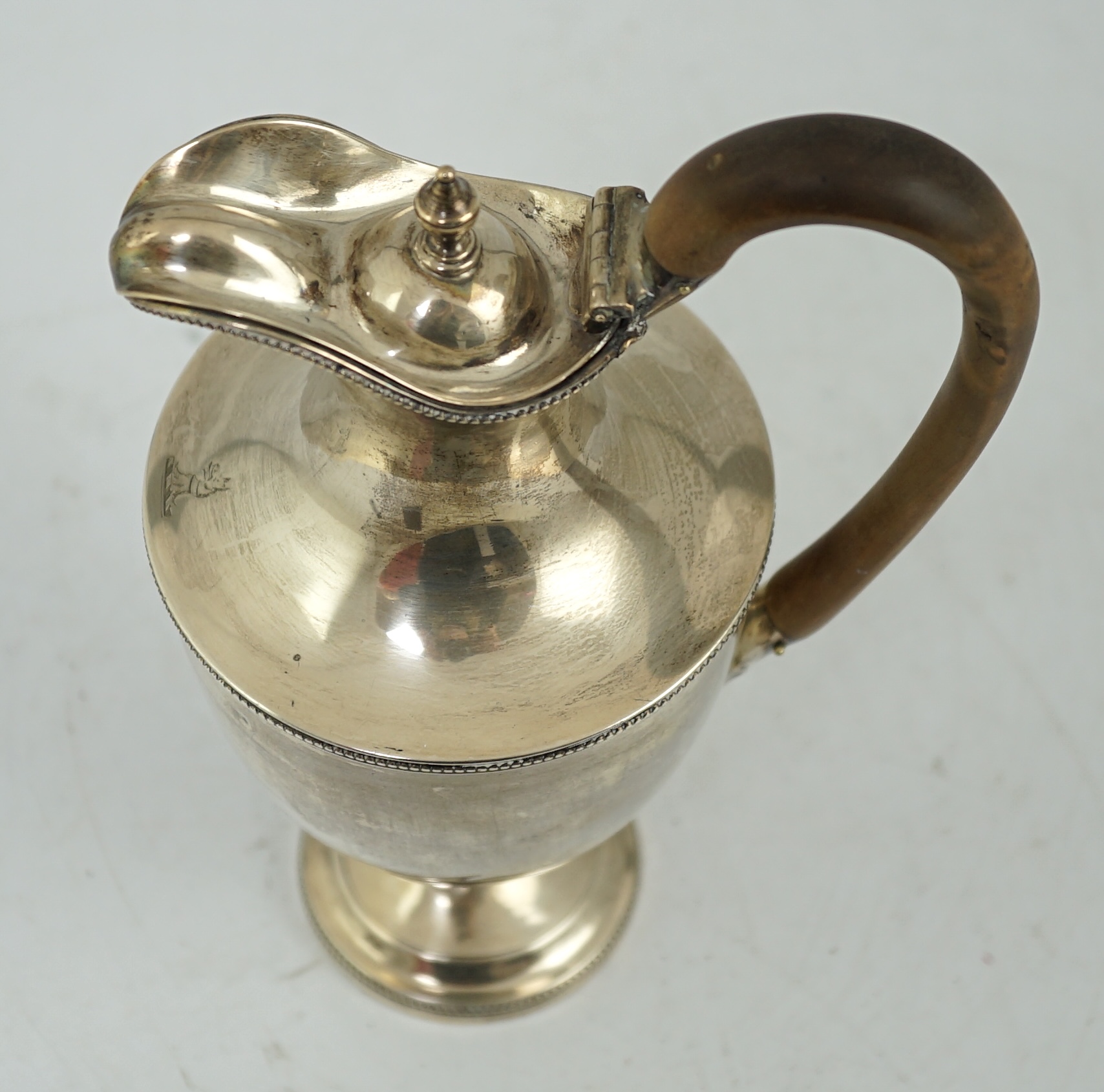 A late Victorian silver pedestal hot water jug, by Jackson & Chase